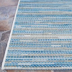 Monte Carlo Coastal Breeze Ocean-Champagne 8 ft. 6 in. x 13 ft. Indoor/Outdoor Area Rug by Couristan -Artistic Weavers || Couristan Sales Store ocean champagne couristan outdoor rugs 23332406086130t 4f 1000